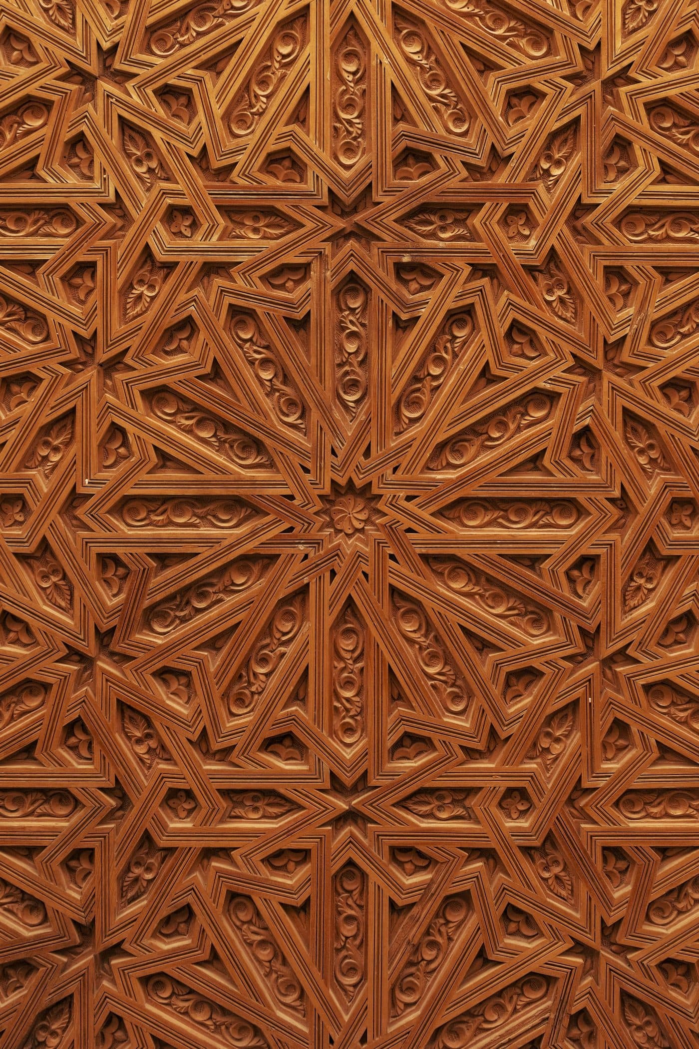 A carved wooden panel worked in a repeating star field.